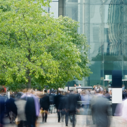 people moving around outside office building