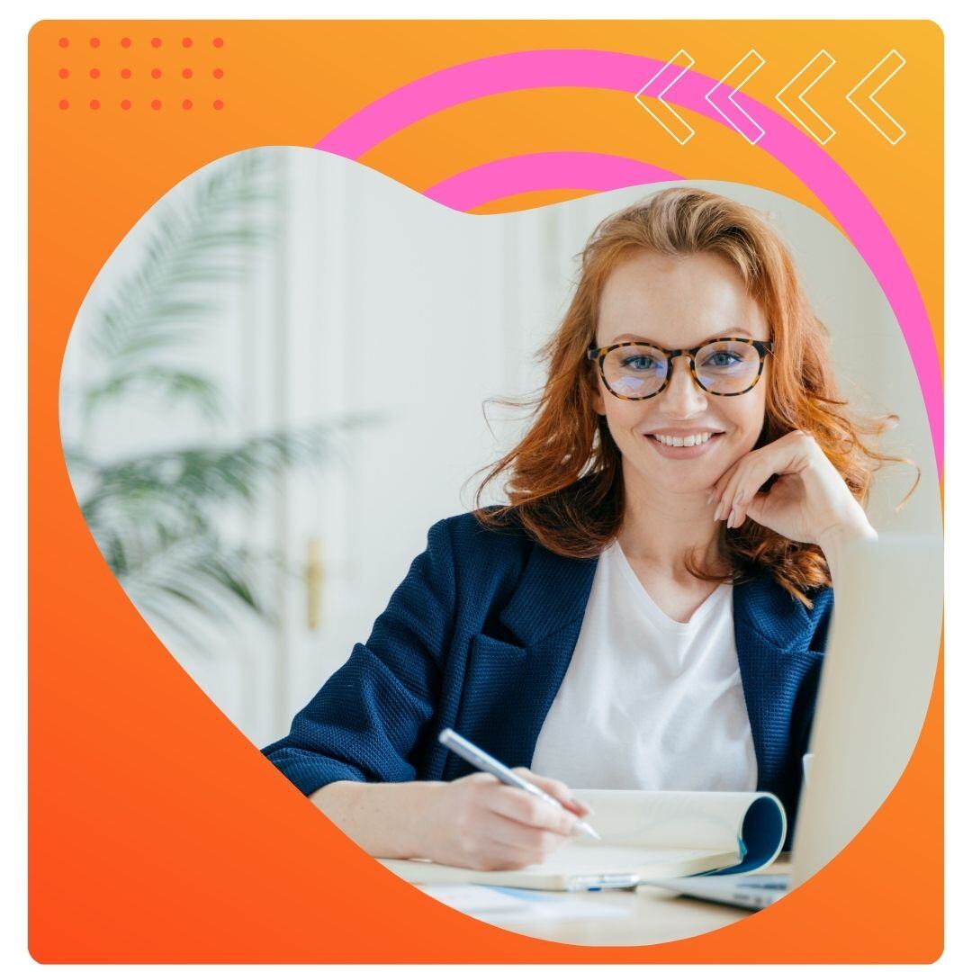 ginger haired woman in office with orange background